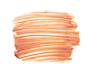 Gently beige strokes and texture of face highlighter or acrylic paint isolated on white background