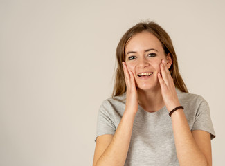 Portrait of happy excited beautiful teenager woman with happy facial expression
