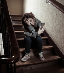 Beautiful lonely young girl depressed and worried suffering from bullying and harassment at school