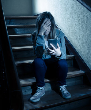 Beautiful lonely young girl depressed and worried suffering from bullying and harassment at school