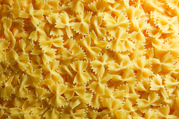 Pasta from durum wheat. Raw farfalle. Healthy food. Italian dishes.