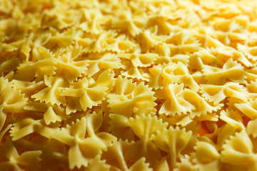 Pasta from durum wheat. Raw farfalle. Healthy food. Italian dishes.