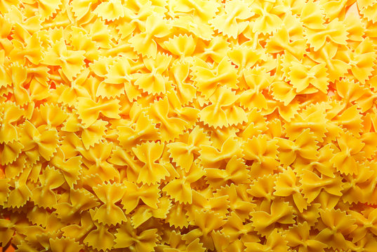 Pasta from durum wheat. Raw farfalle. Healthy food. Italian dishes.