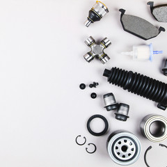 Set of car parts for maintenance on grey background