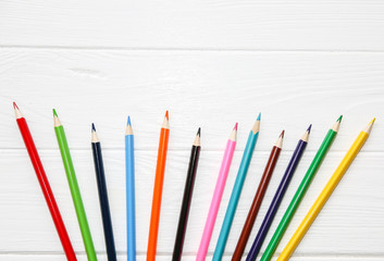 Colorful pencils on white wooden background. back to school concept. Art creative photo.