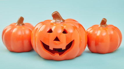 Glowing jack lanterns on pastel pale blue