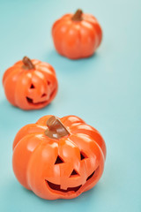 Glowing jack lanterns on pastel pale blue