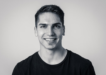 Portrait of attractive cheerful young man with smiling happy face. Human expressions and emotions