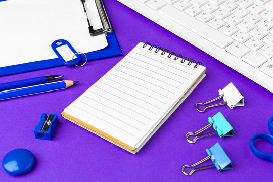 Composition Of Office Lifestyle Items On  Purple Background, Computer Keyboard Office Supplies On Desk In Office