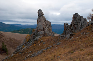 Fototapeta premium Suvo in Barguzin Valley Russia, cattle grazing near rock formations