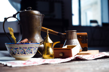Fresh coffee in cezve on wooden table