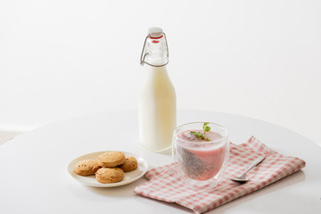 Chia pudding with yogurt and berries in glass