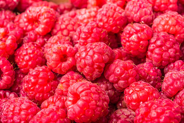 Red ripe strawberry berries closeup. Macro photo of raspberry, red berry background