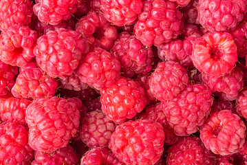 Red ripe strawberry berries closeup. Macro photo of raspberry, red berry background