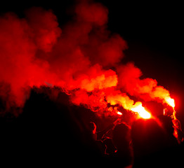 Fototapeta na wymiar red smoke from smoke bombs at a concert