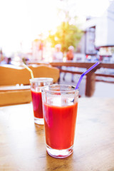 Glass of red tomato juice tubule