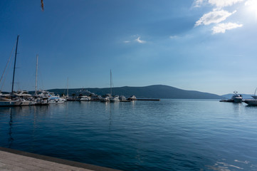 Fototapeta na wymiar Porto Montenegro. Yachts in the sea port of Tivat city. Kotor bay, Adriatic sea. Famous travel destination.