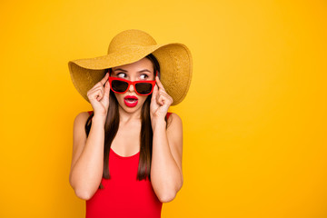 Photo of amazing lady nice look came seaside trip voyage listen hotel neighbors fight sly person wear specs sun hat red swimming suit isolated yellow background