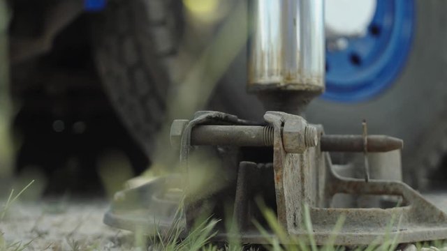 Close Up of Metal Ground Support of Heavy Mobile Crane Machine on Construction Location