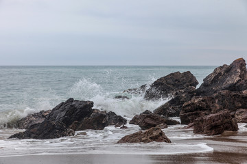 Sea Water Laps among the Stones