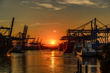 Fototapeta na wymiar Port of Hamburg Waltershof at sunset