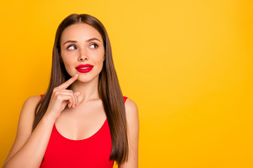 Close-up portrait of her she nice-looking attractive lovely adorable charming cute winsome straight-haired lady looking aside thinking touching chin isolated over bright vivid shine yellow background