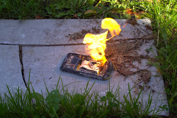 Burning smartphone, burning mobile phone