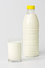 bottle and glass of fresh milk isolated on white background