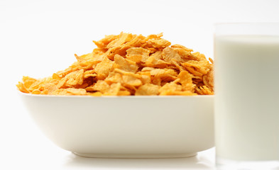 cornflakes in bowl isolated on white background