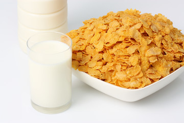 bowl of cereal with milk and a glass of milk