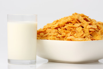 bowl of cereal with milk and glass of milk