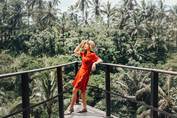 Obraz na płótnie Canvas Young pretty Asian woman is standing with mountain view, Ubud, Bali.