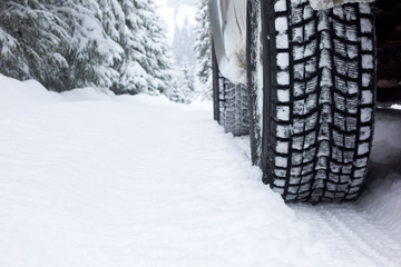 Winter Tire on snow covered road.