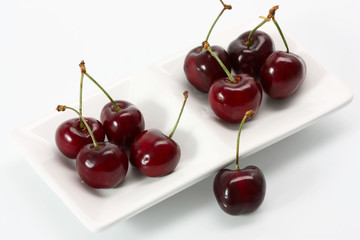 cherries in a bowl isolated on white