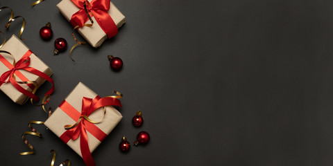 Christmas holiday celebration paper gift boxes gold sparkles with red christmas balls. Presents...