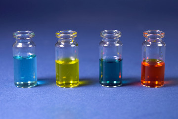 Multicolored liquids in glass vials