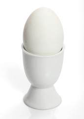 egg in cup isolated on white