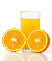 glass of juice with slice of orange