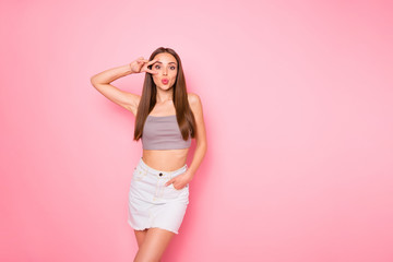 Portrait of her she nice-looking lovely girlish charming cute pretty cheerful cheery funny straight-haired lady showing v-sign near eye sending kiss posing isolated over pink pastel background