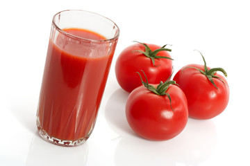 glass of tomato juice and tomatoes isolated on white