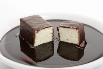 soft chocolate-covered candy filled with milk souffle