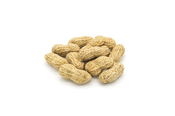 Stacked fresh shelled peanuts close-up on a white background