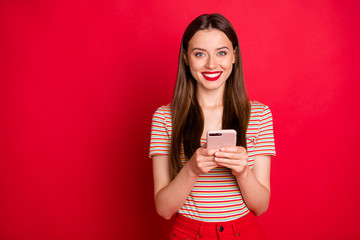 Photo of pretty charming funky lady in almost total red look holding checking-in her flight on...