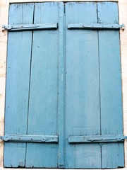 Frame with a big blue wooden window for background. Front view.