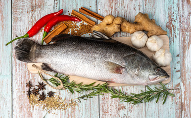 Fresh Sea Bass on wooden table