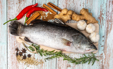 Fresh Sea Bass on wooden table