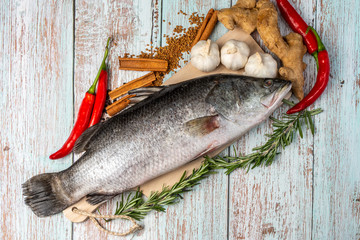 Fresh Sea Bass on wooden table