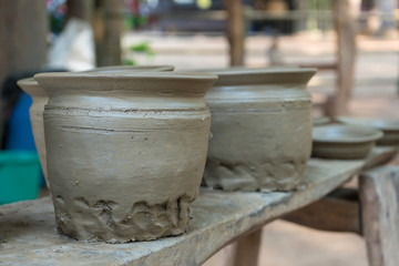 Clay pots made by hand of Thai traditional old pottery jar