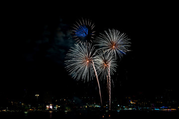 Colorful fireworks of various colors at night with celebration and anniversary concept