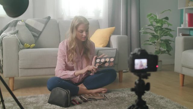 Girl blogger talks on camera about powder